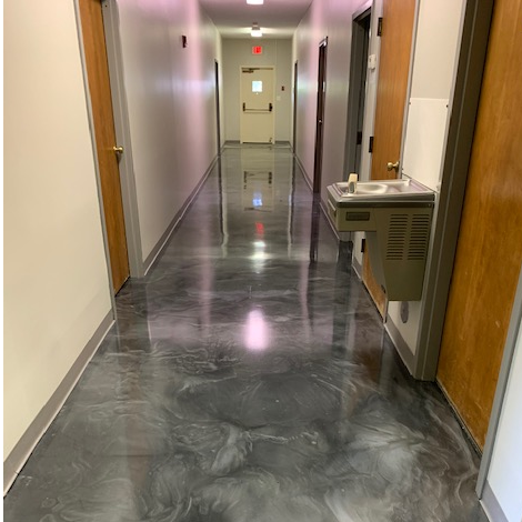 An office hallway with commercial epoxy floors done by Concepts on Concrete based out of Rathdrum, Idaho.